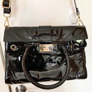 Large patent-leather Jimmy Choo crossbody bag.